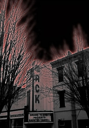low angle picture of the Mack theatre front with a red filter